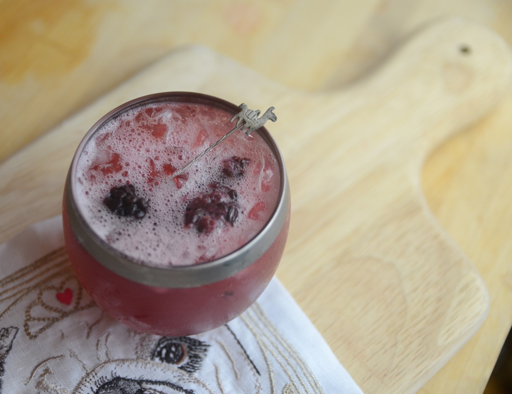 Sloe Gin cocktail with blackberry and lemon