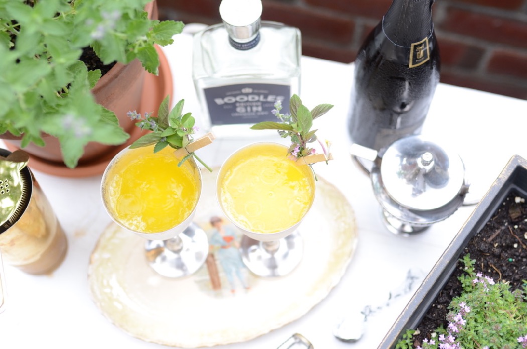 yellow cocktail with Boodles Gin with mint garnish